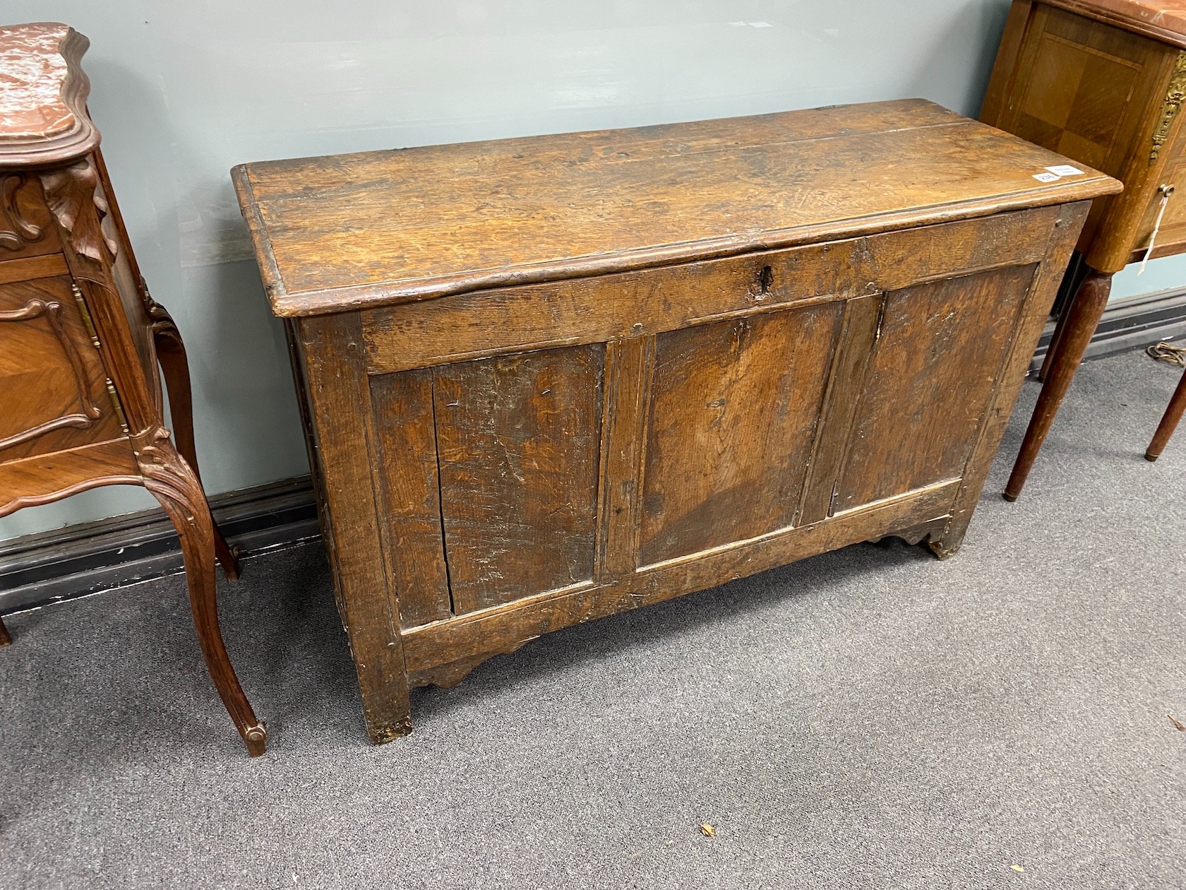 An early 18th century oak triple panelled coffer, length 110cm, depth 42cm, height 68cm